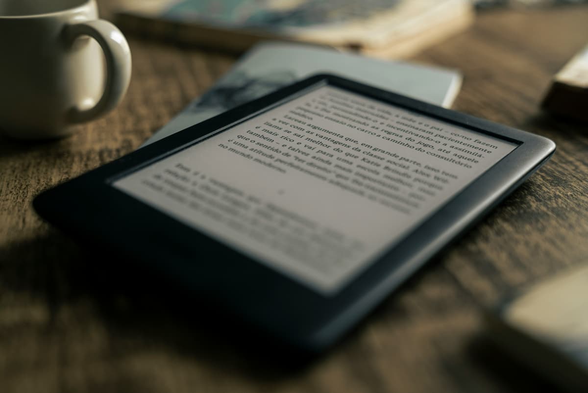 Reader using an e-reader, reflecting PRC Publishing's audience of practical, modern professionals